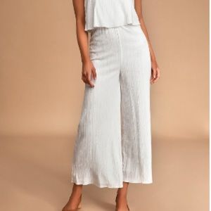 White sleeveless ruffled culotte jumpsuit